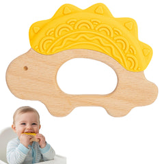 JUNUNA dinosaur teether in pink blends silicone and wood to soothe gums.