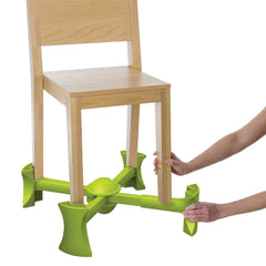 KABOOST booster seat under chair showing stable toddler seating at the table.