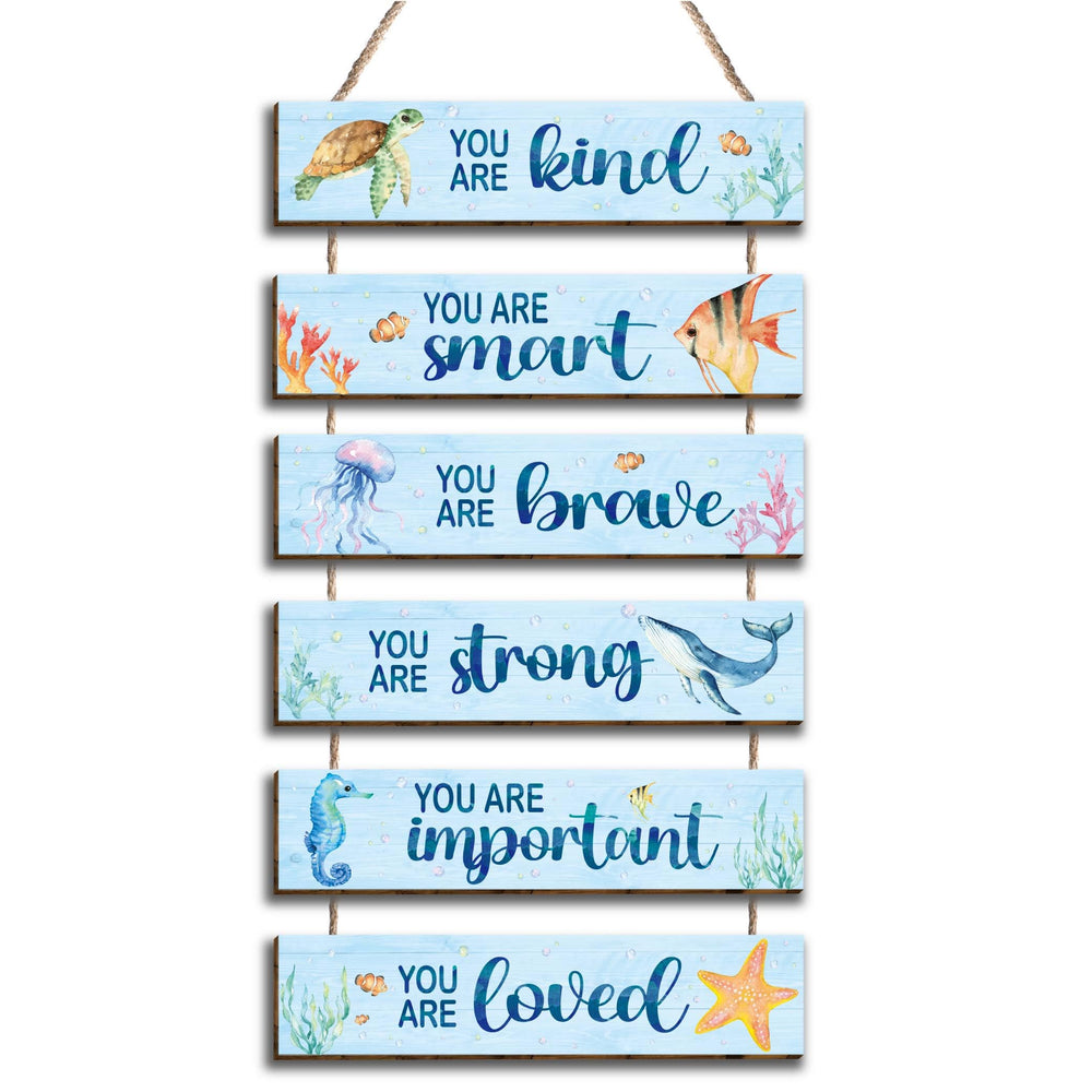 Kadiak ocean decor placards for kids' room brighten walls with positive quotes.