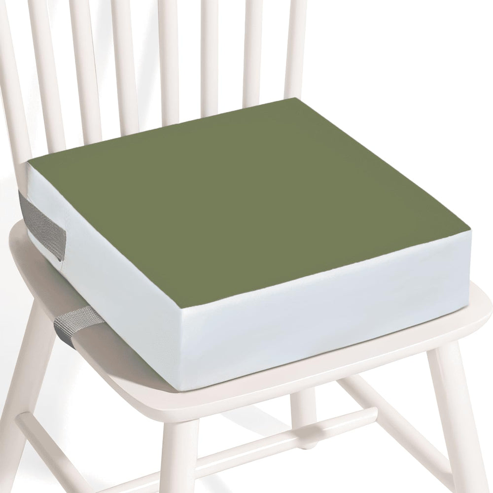 KAGIWEI booster seat on a dining table showing PU waterproof surface for easy cleanup