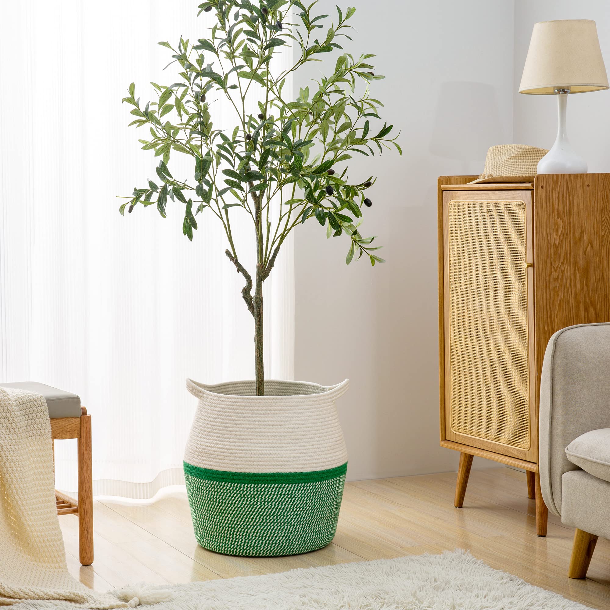KAKAMAY blanket and pillow basket in green blends with decor.