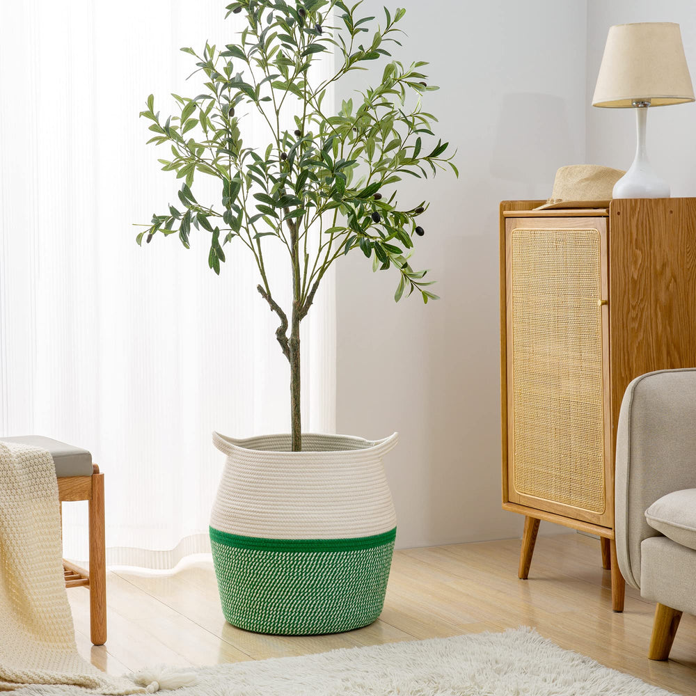 KAKAMAY blanket and pillow basket in green blends with decor.