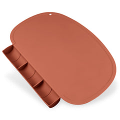 Kalovin silicone placemat with food catcher pockets keeps spills near the plate and easy to wipe.