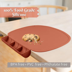 Kalovin placemat features raised edges to contain sauces and crumbs.