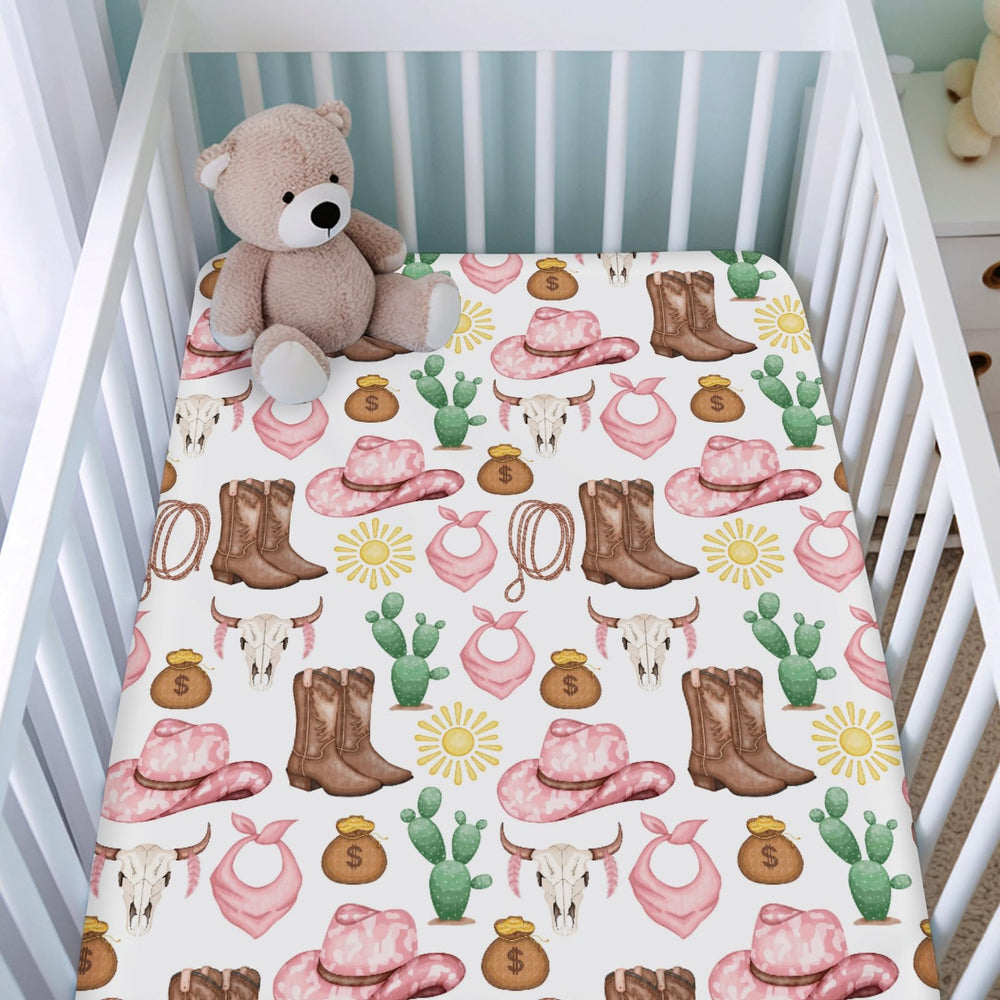 KASTLEE cowgirl-print baby sheet showcasing playful pattern for gender-neutral nurseries