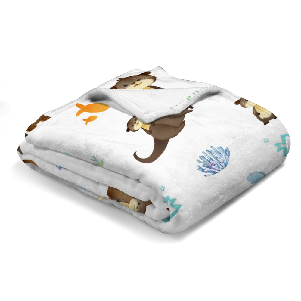 KASTLEE nursery decor sea otter blanket complements kid's room styling.