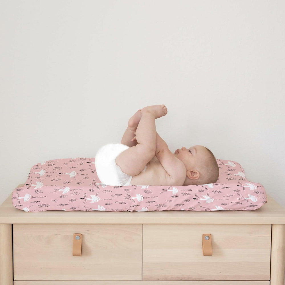 Nursery setup with KASTLEE Pink Ballet cover creates a cozy, coordinated look.