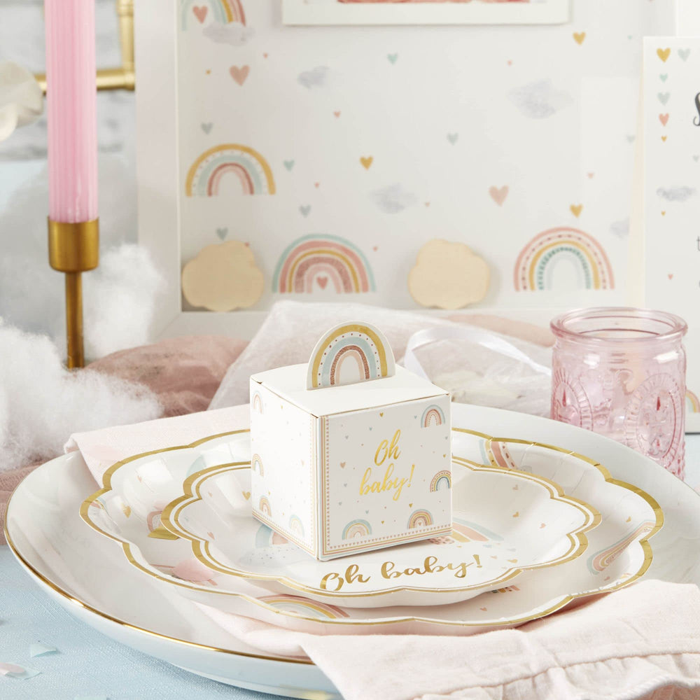Soft watercolor rainbows on the sides enhance table decor