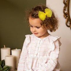 Large 4-inch mesh bow enhances ponytails and buns with flair.