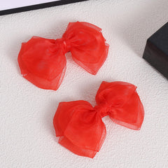 KCHIES Poppy Red organza double bow with secure, comfortable grip.