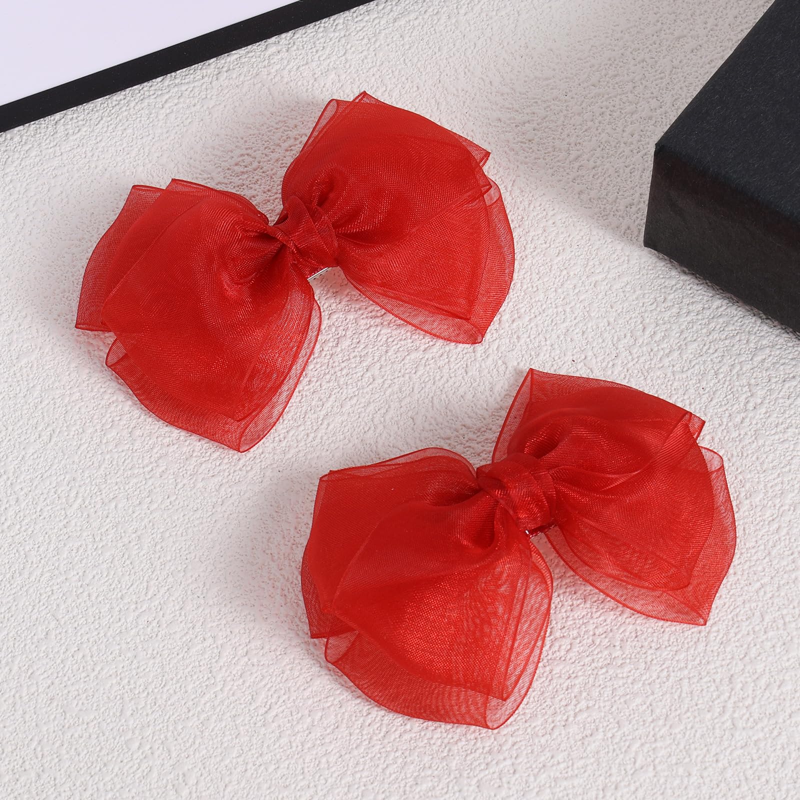 KCHIES red mesh bow clip side view, lightweight comfort for all hair types