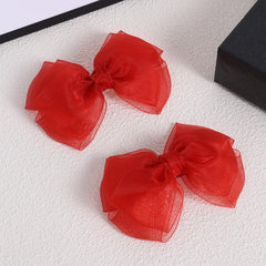 KCHIES red mesh bow clip side view, lightweight comfort for all hair types