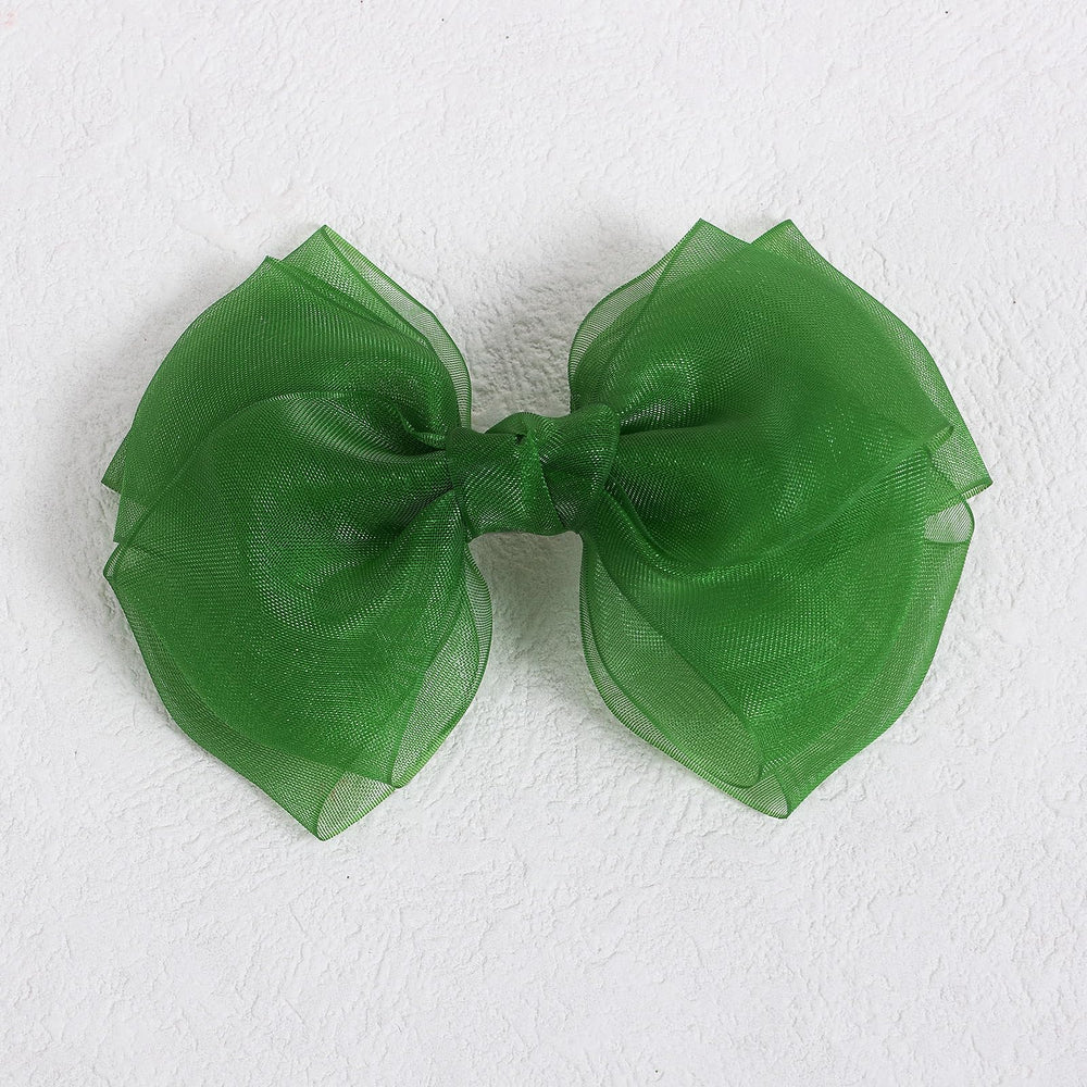 KCHIES versatile bows for ponytails buns and half-up looks.