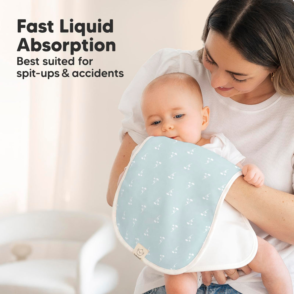 Baby wearing a KeaBabies burp cloth during feeding time.