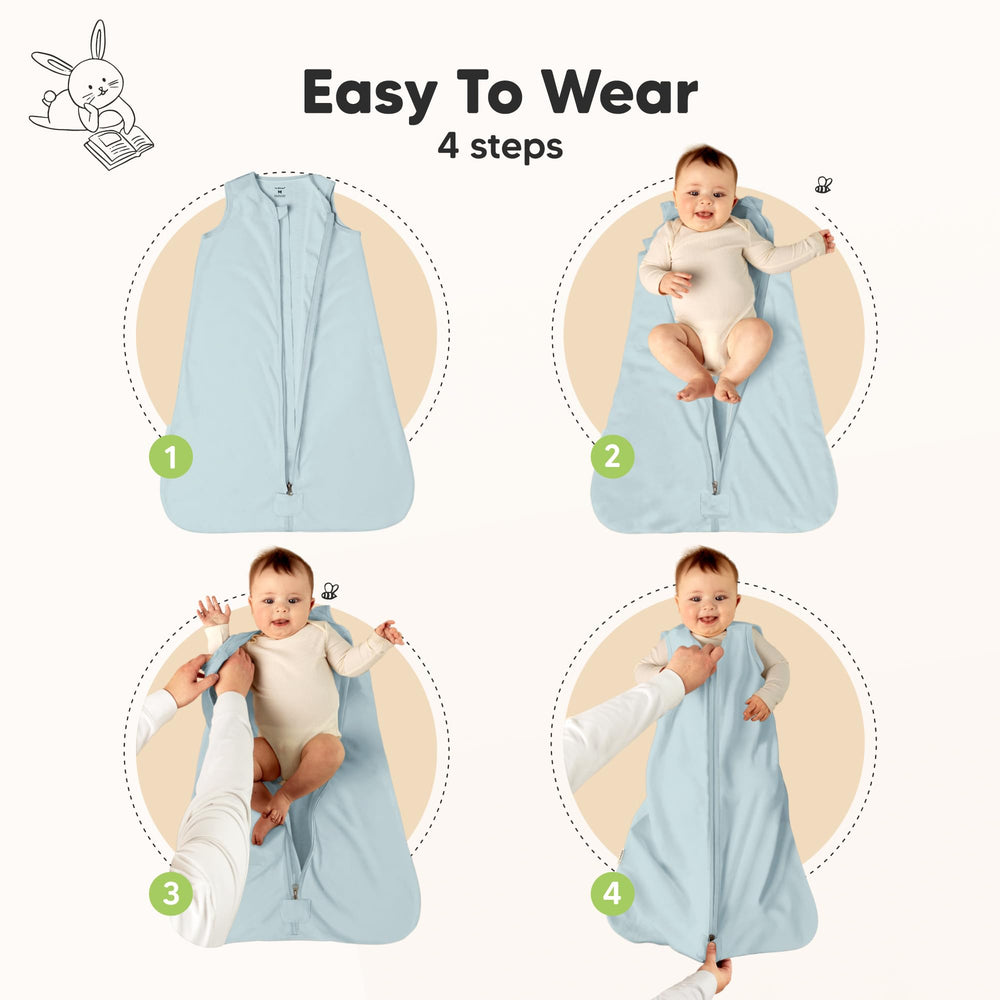 Baby wearable blanket with ergonomic armholes and hip room for natural movement