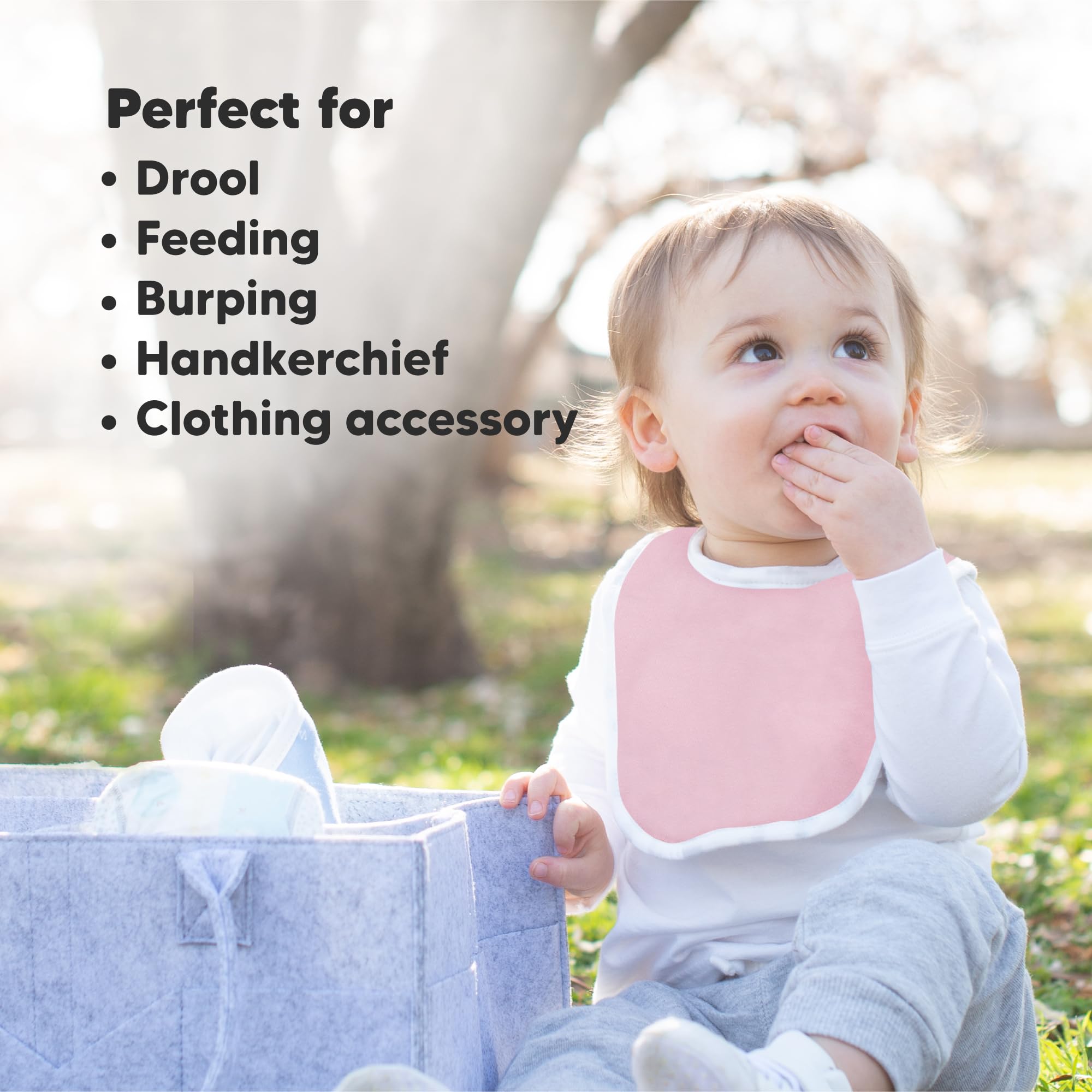 KeaBabies bibs on a smiling baby during drool and spills ready for messes.