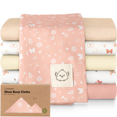 KeaBabies butterfly-pattern burp cloth catching spit-ups during feeds