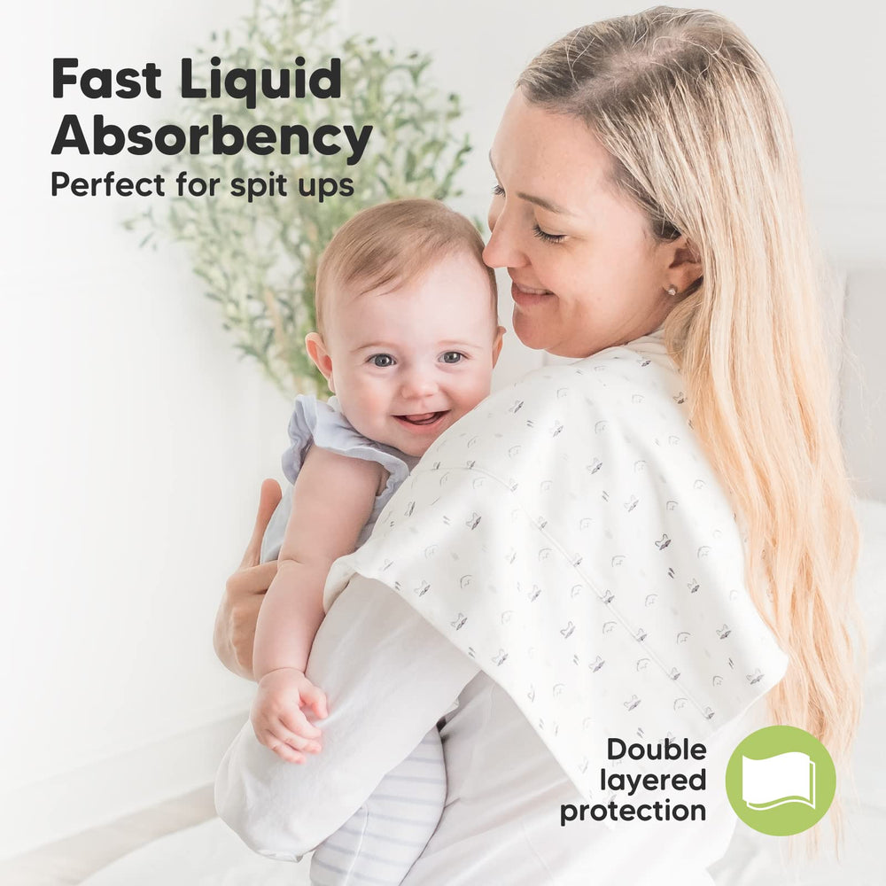 KeaBabies burp cloths on shoulder catching spills with soft absorbency.