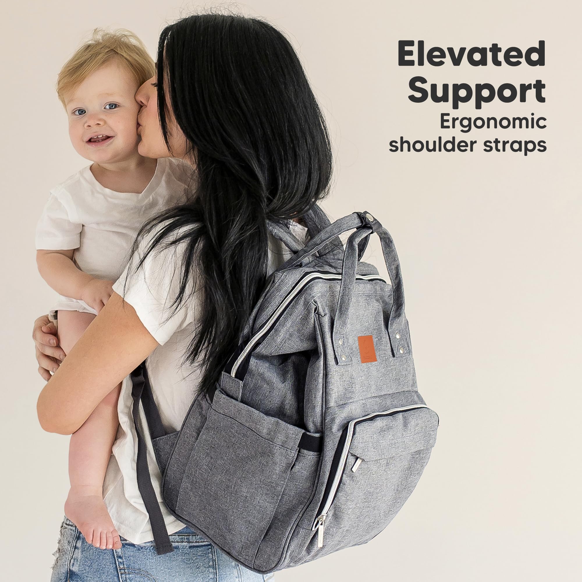 KeaBabies Diaper Bag Backpack hands-free use while carrying baby in carrier.