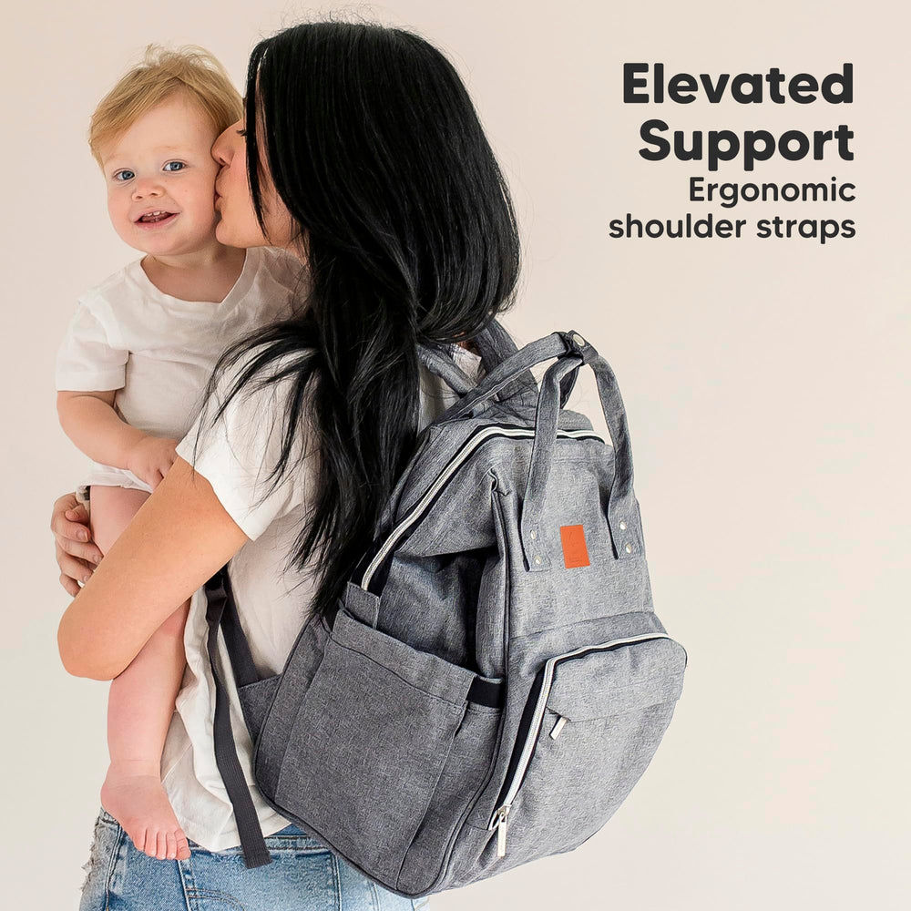 KeaBabies Diaper Bag Backpack hands-free use while carrying baby in carrier.