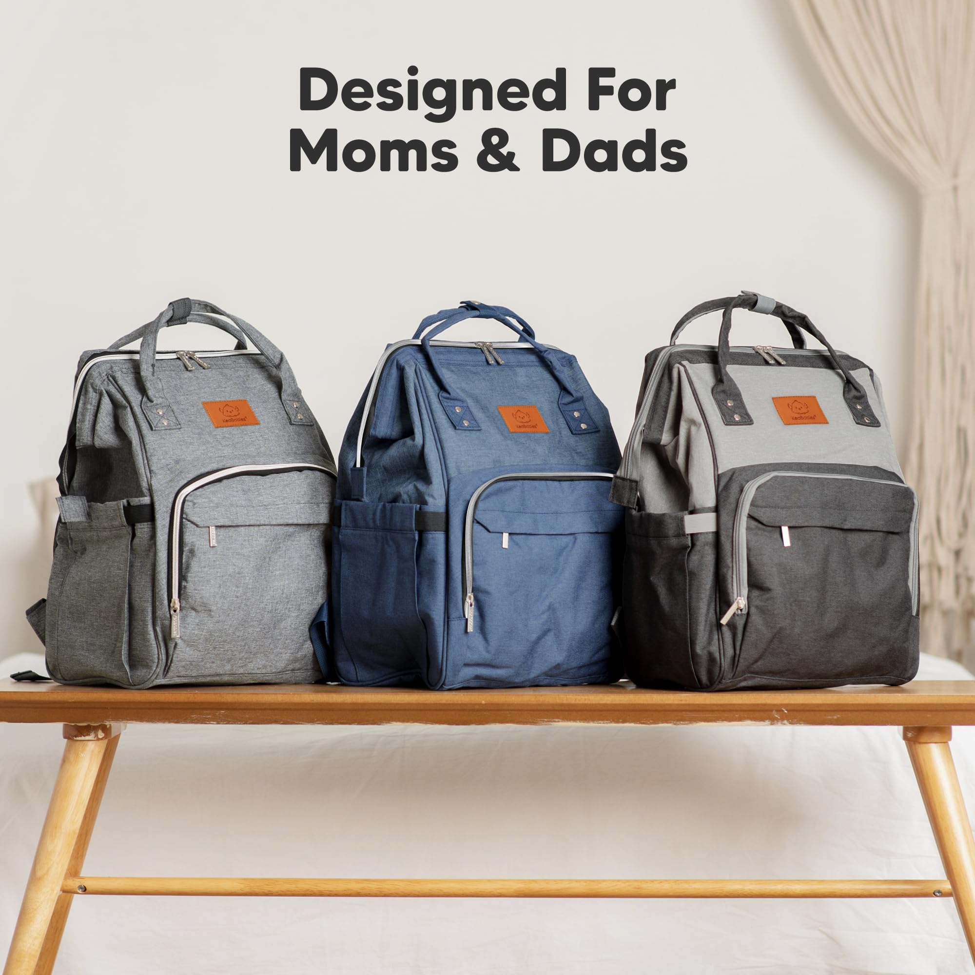 KeaBabies Diaper Bag Backpack wide opening for quick item retrieval.