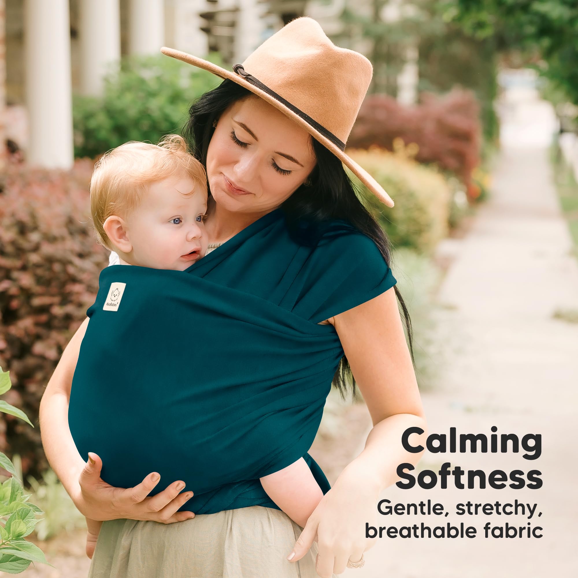 KeaBabies Original Baby Sling demonstrates ergonomic hip support for comfortable positioning.
