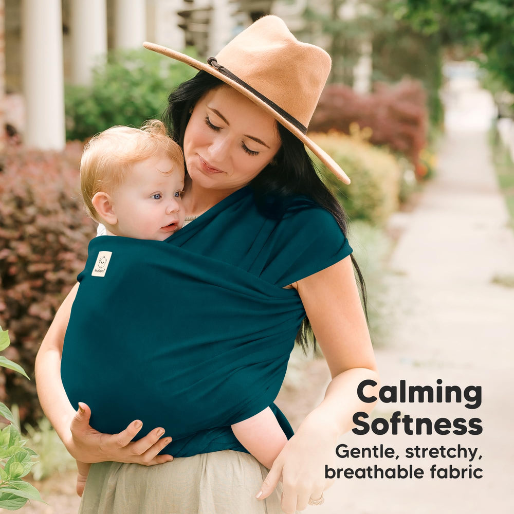 KeaBabies Original Baby Sling demonstrates ergonomic hip support for comfortable positioning.
