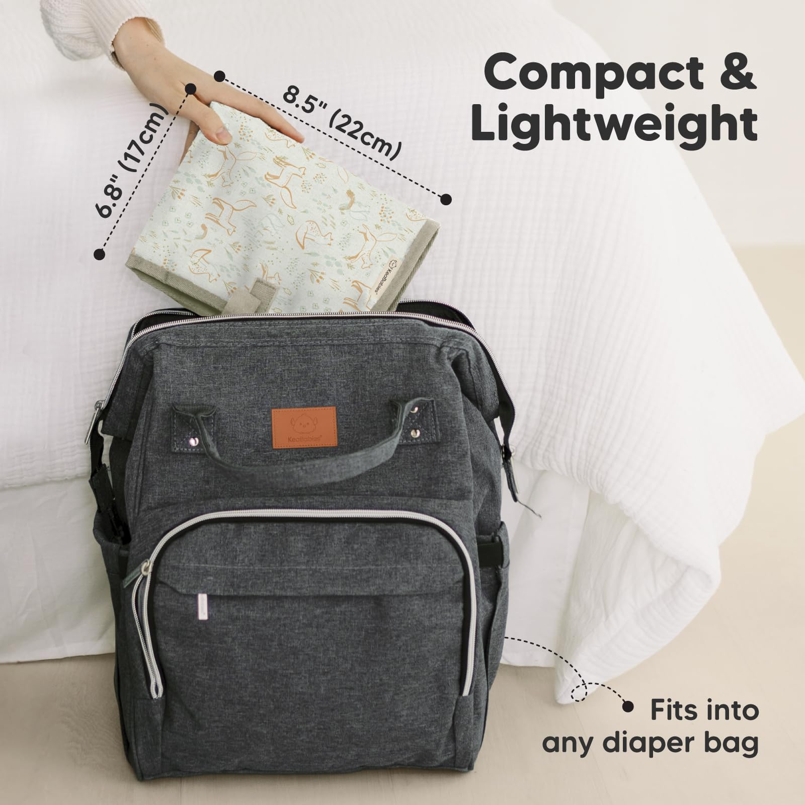 KeaBabies portable changing pad folded into compact clutch for on-the-go storage.