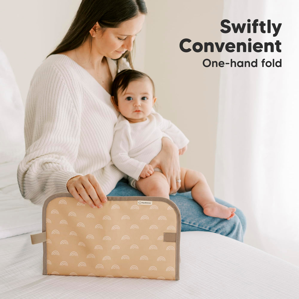KeaBabies portable changing pad placed inside diaper bag for travel