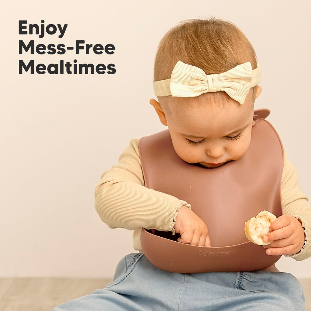 KeaBabies silicone bib pairs well with plates and spoons for coordinated meals