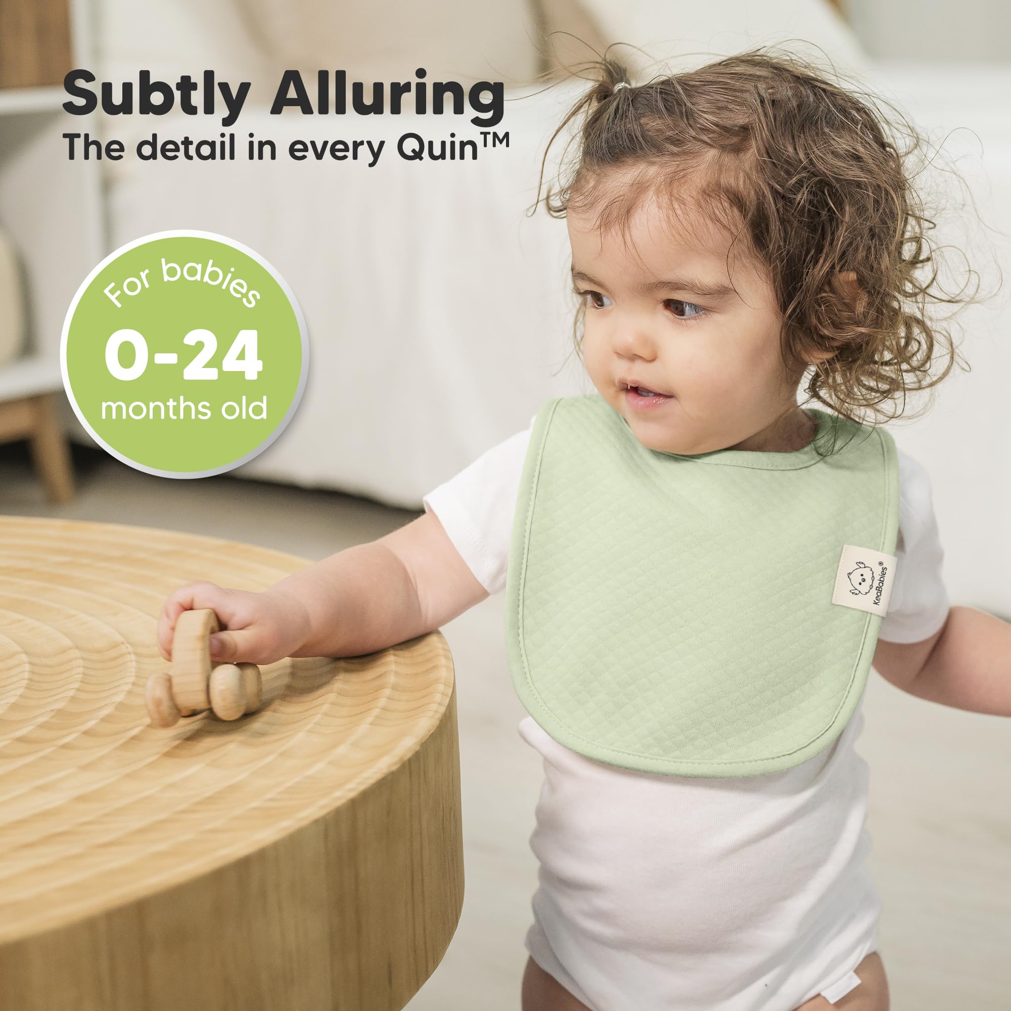 Adjustable nickel-free snaps on KeaBabies Urban Quin bib for growing babies