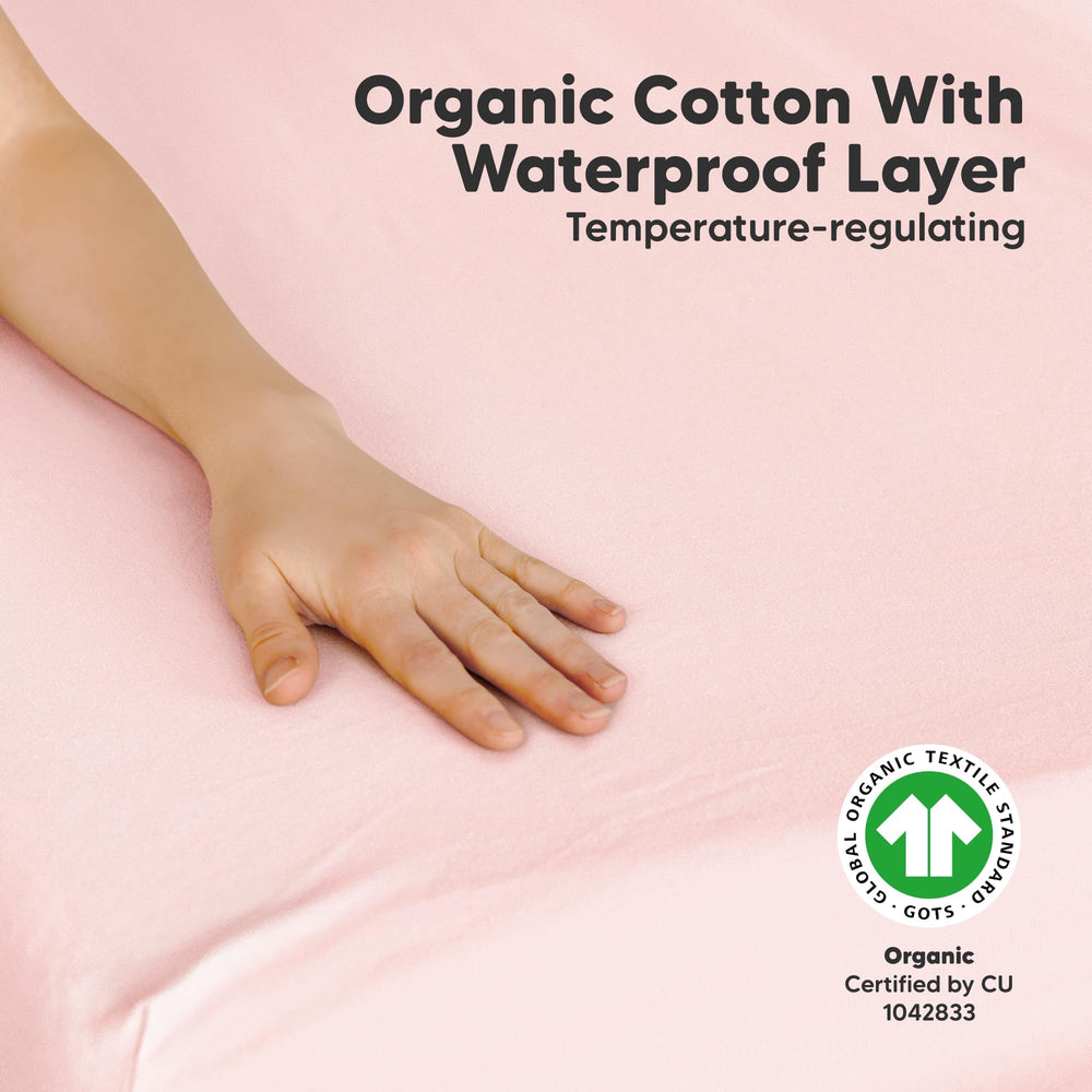 Waterproof layer protects the playard mattress from spills on KeaBabies sheets.