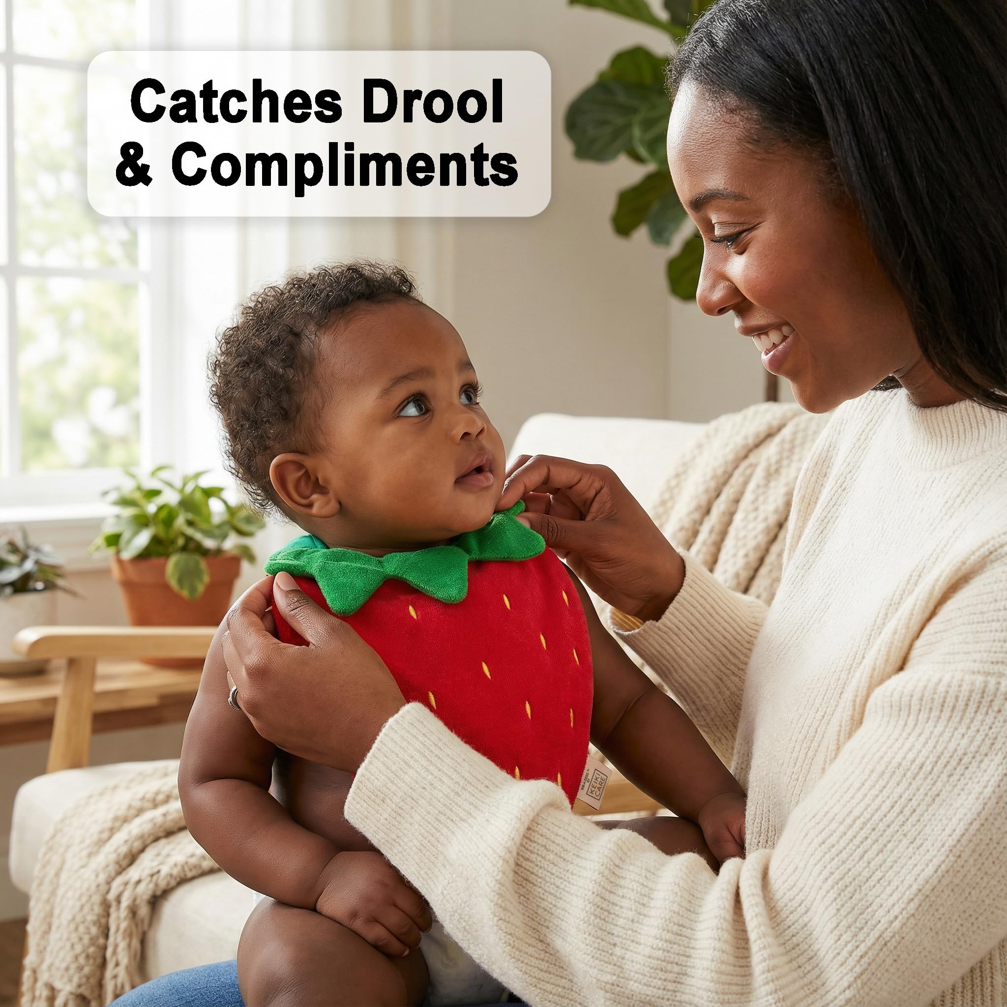 Keiki Care strawberry-shaped bib front view, charming design for mealtime protection.