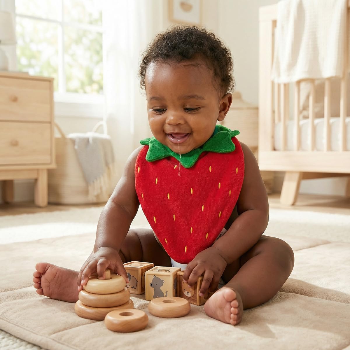 Keiki Care strawberry bib in use during feeding and play.