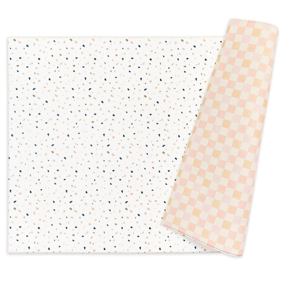 Keiki Care reversible play mat with dual designs for versatile play spaces.