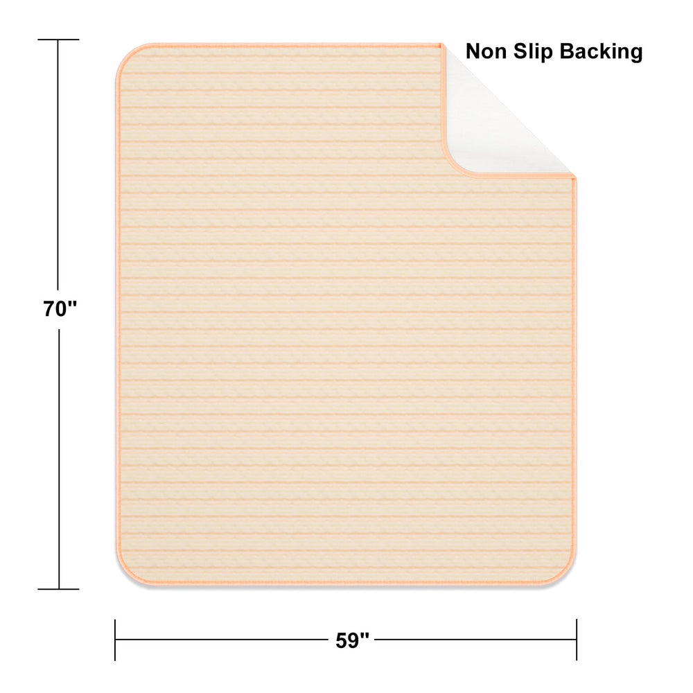 Kelisiting machine-washable bed pad ready for laundry after use.