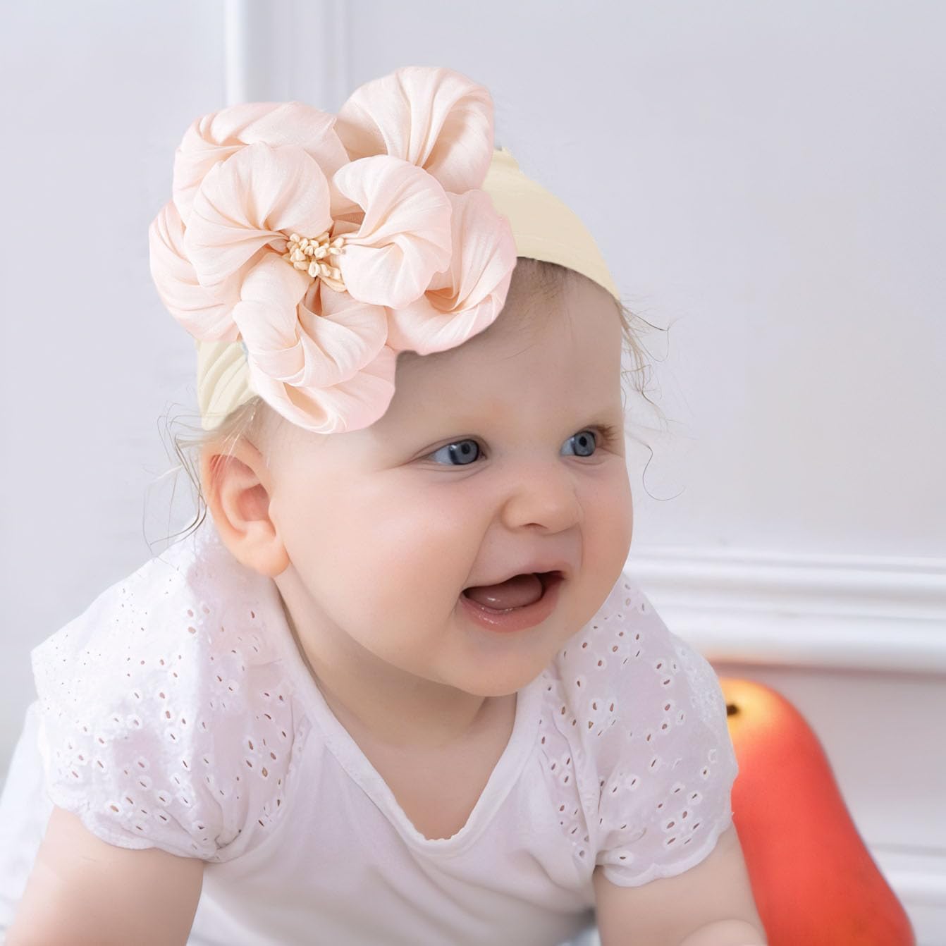 Kenjudess flower headband in salmon pink adds color for photoshoots