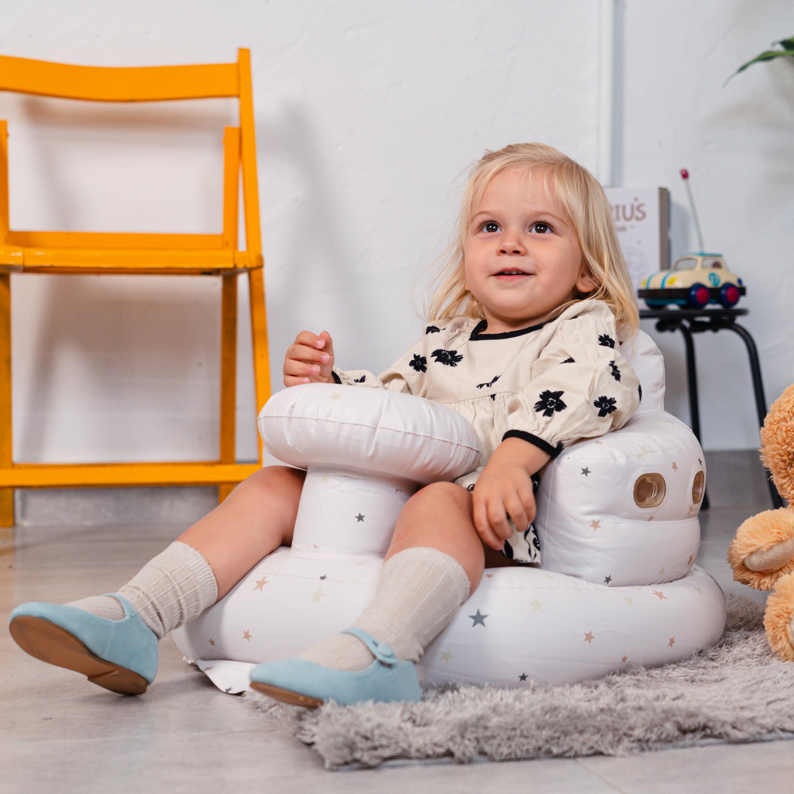 Kewrius sit-me-up chair supports curious babies during indoor and outdoors moments.