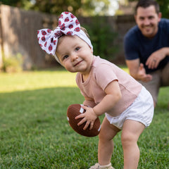 Kexinstar football baby bow headband white-gold-prints, stylish print for game day outfits.