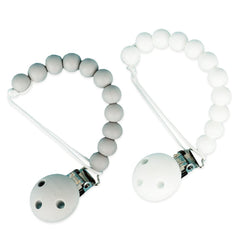 KH Kids Heroes silicone pacifier clip in grey attaches to clothing.