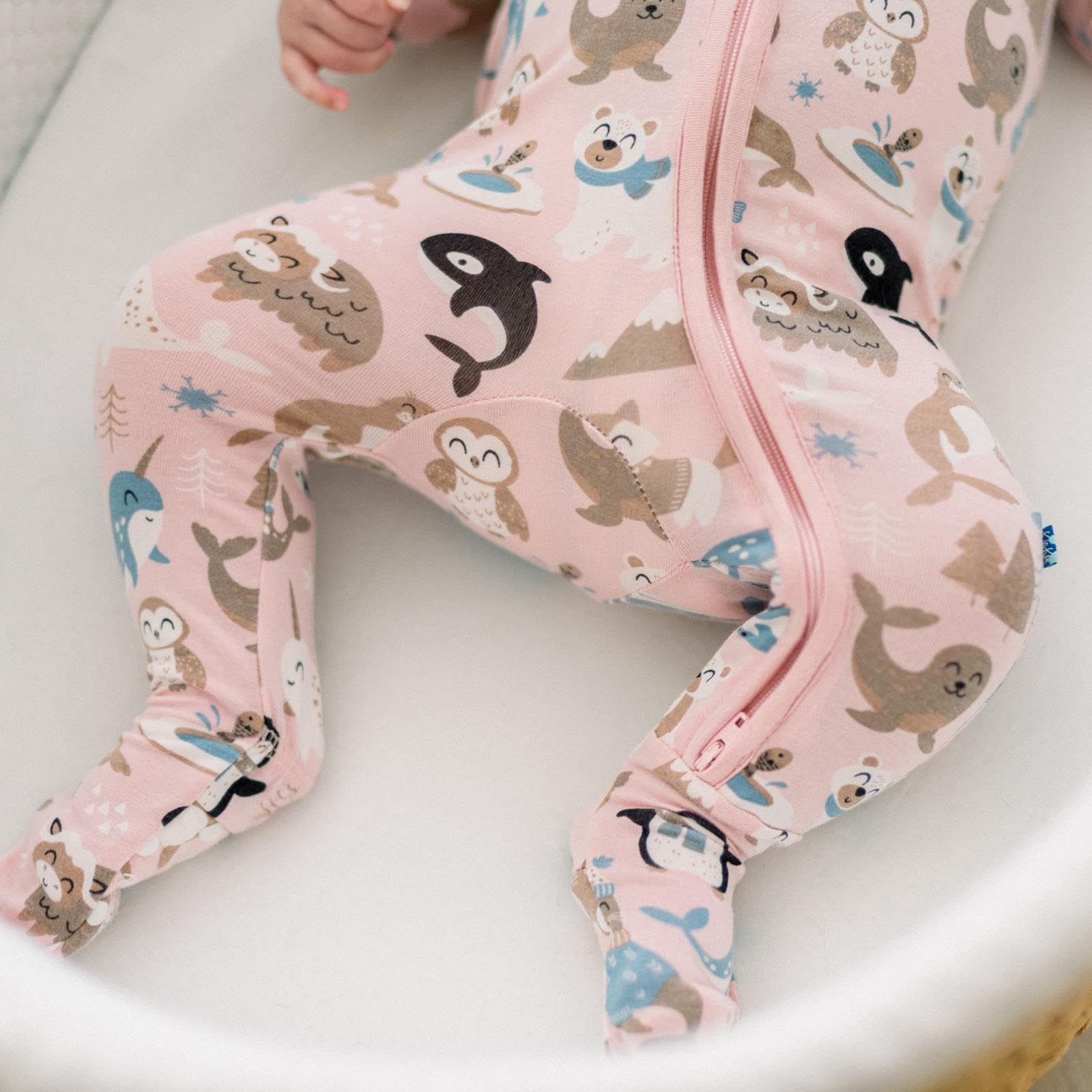 KicKee Festive Footie Pajamas Arctic Animals print adds festive charm.