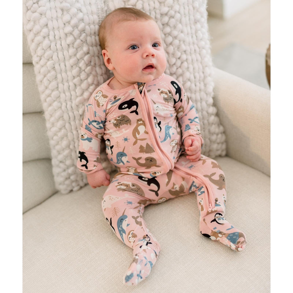 KicKee Festive Footie Pajamas flip paws for playful warmth and grip.