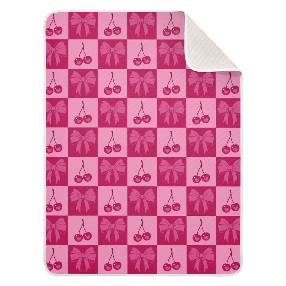 KICPOAY checkered pink cherries and bows swaddle, front view, cozy baby wrap