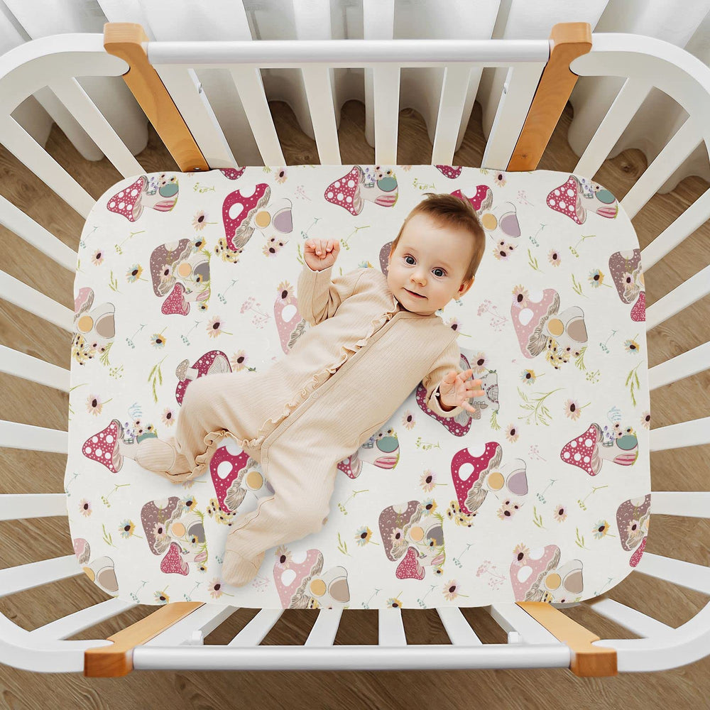 KICPOAY playard sheet showcases mushroom-daisy pattern for cozy travel-ready bedding