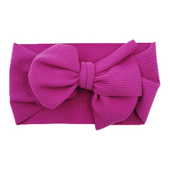 KIDOCHEESE adjustable-band headband designed for comfortable all-day wear.