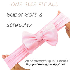 KIDOCHEESE adjustable stretch headband on a baby, flexible fit.