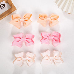 KIDOCHEESE grip-base clip keeps hair secure without slipping.