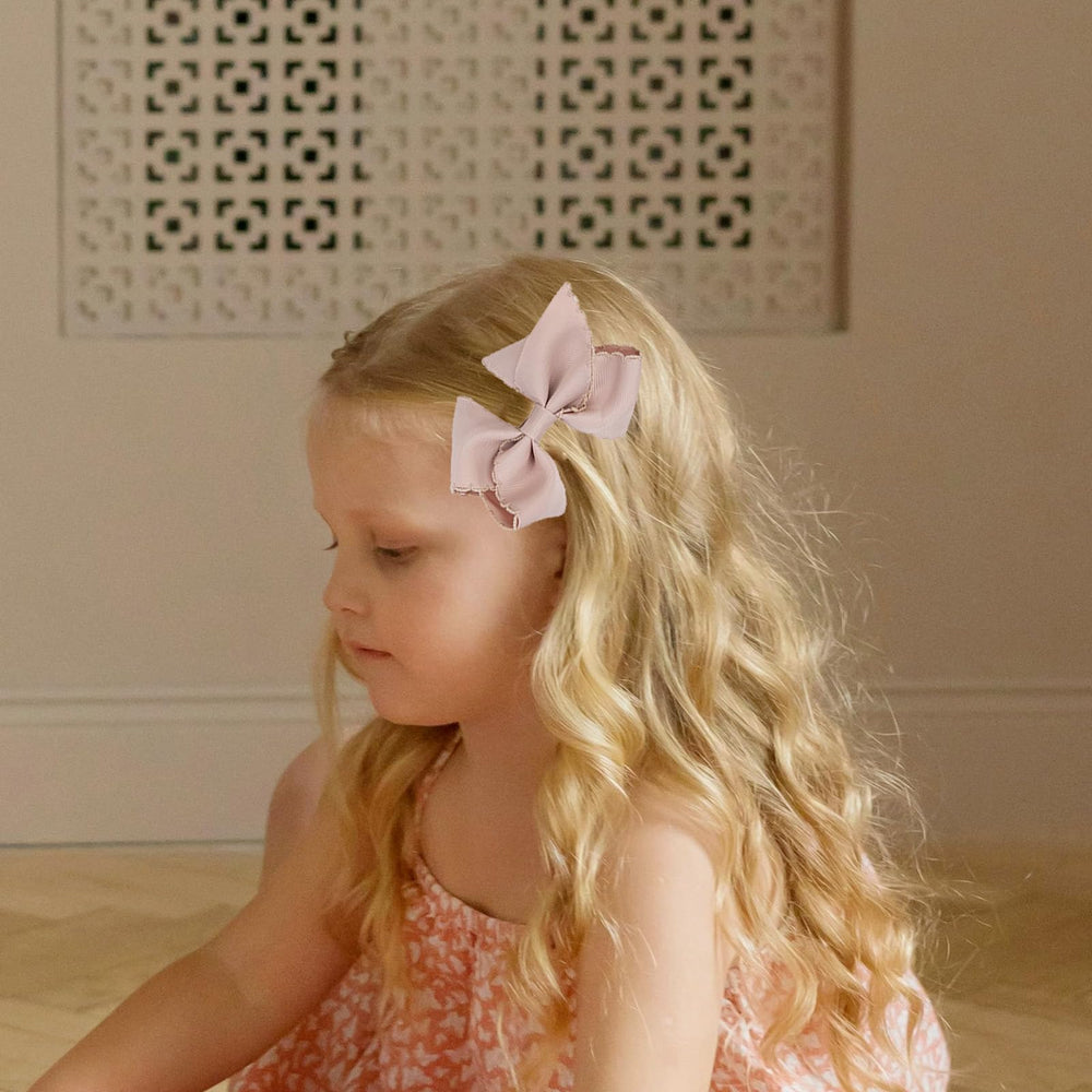 KIDOCHEESE yellow grosgrain bow clip adds cheerful color for outfits.