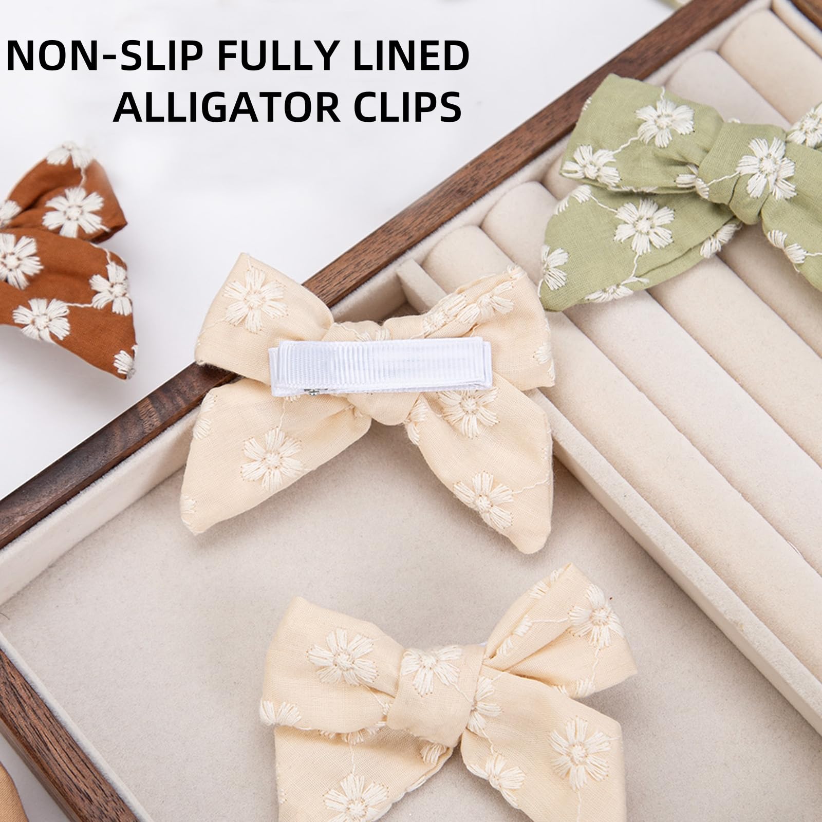 Kidocheese ivory grosgrain covered clip protects delicate hair while staying put.