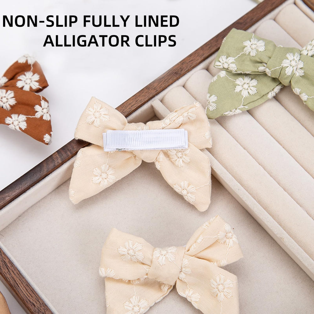 Kidocheese ivory grosgrain covered clip protects delicate hair while staying put.
